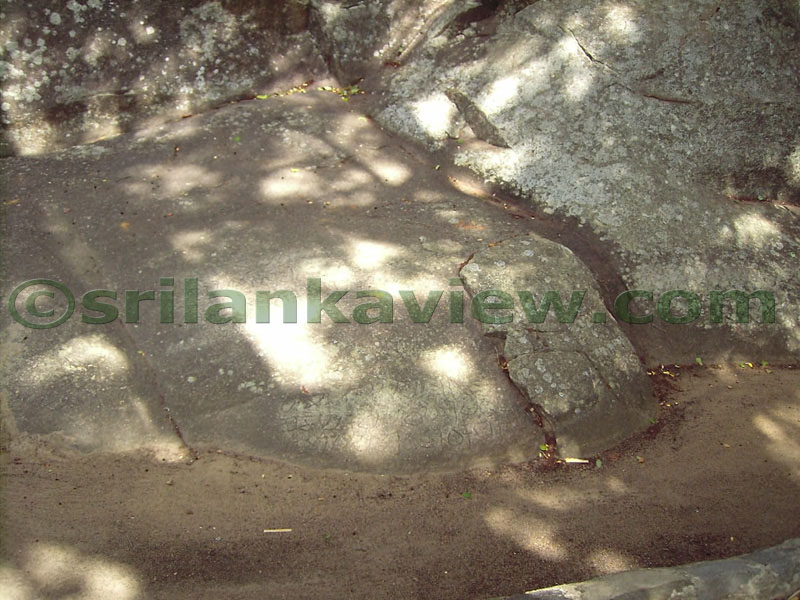Inscriptions on the rock at the very bottom.