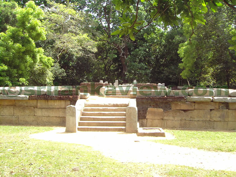 Square shaped shallow stone tub for washing feet used at Image house entrance.