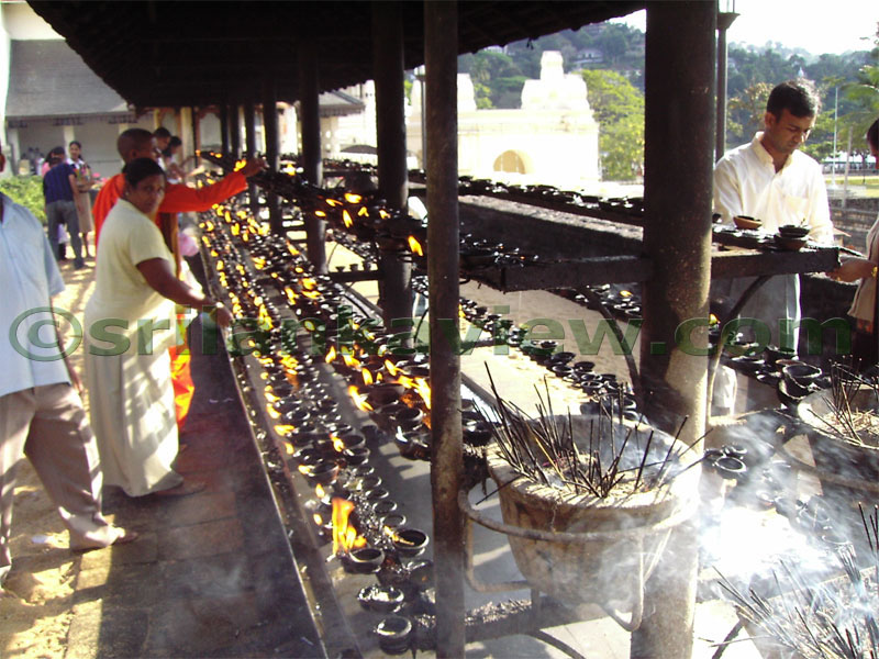 The outside courd yard where people light oil lamps and incense sticks to honour the Gauthama Buddha.