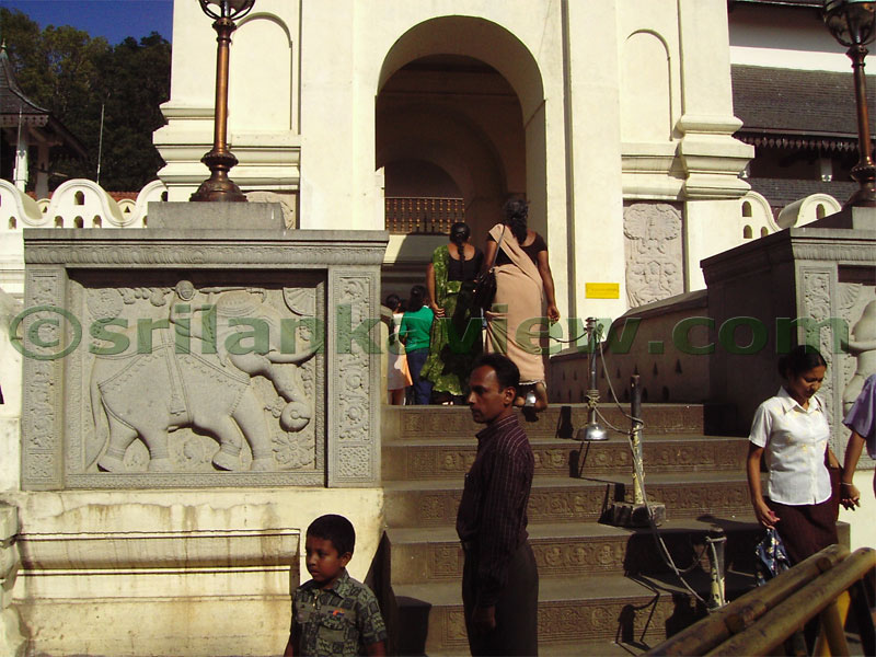 Devotees going to the temple to pay homage to Lord Buddha.