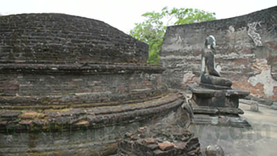 Stupa and seated buddha statue 