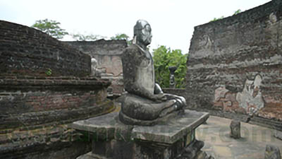 Stupa and seated buddha statue