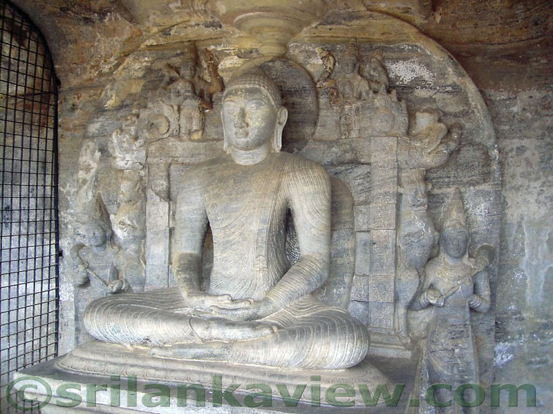 The Samadhi Buddha statue in the 'Nisinna Patima Guha' on a throne.