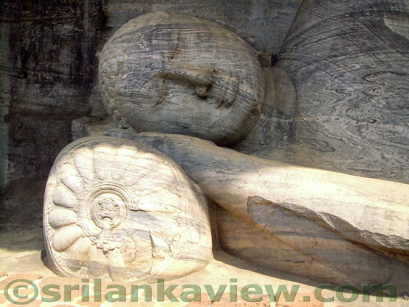 The Gauthama Buddha Image with the head resting on a cushion decorated with a lion figure in the middle.