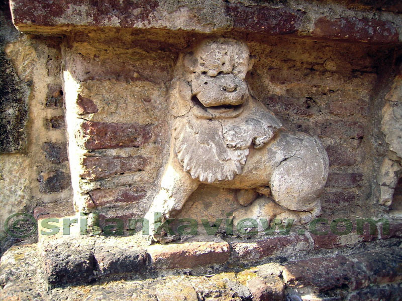 Lion figure sculptured from brick and stucco.
