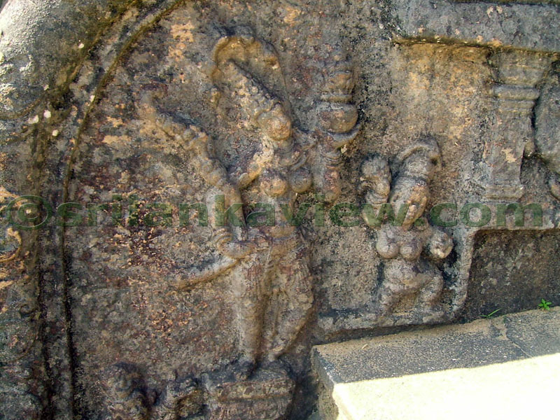 Figures appearing on a balustrade.
