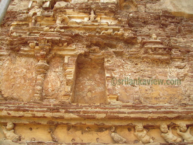 Designs at Outer Brick Walls,Notice the Lion and deva figure