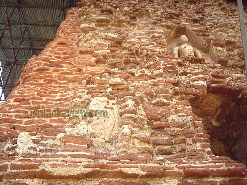 The weathered and partly destroyed brick walls at Tivanka Pilimage, Polonnaruwa.