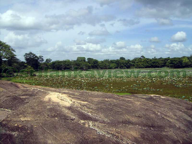 At one end of the rock, is this lake or wewa.